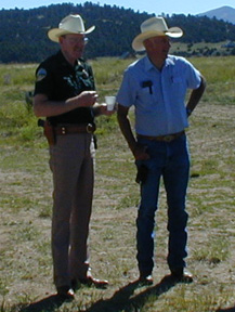 Sheriff Fred Jobe warns Custer County Commisioner - Dick Downey about the dangers of flying too slow........